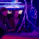 Ellie and Riley are seen playing on a Mortal Kombat II arcade cabinet.